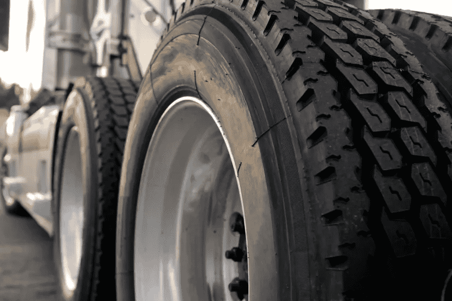 Semi-truck wheels are shaped differently for practical reasons: