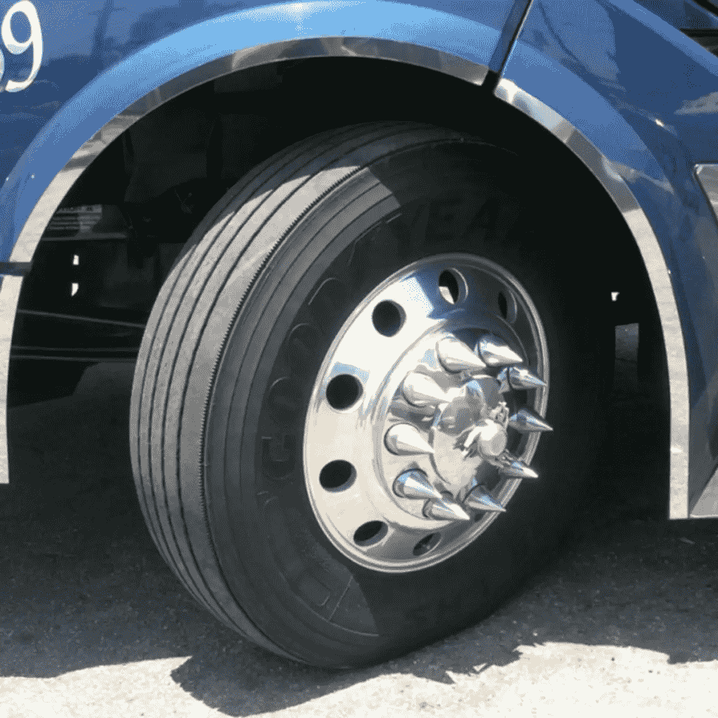 Why do many semi trucks have spikes on the side of their front tires?