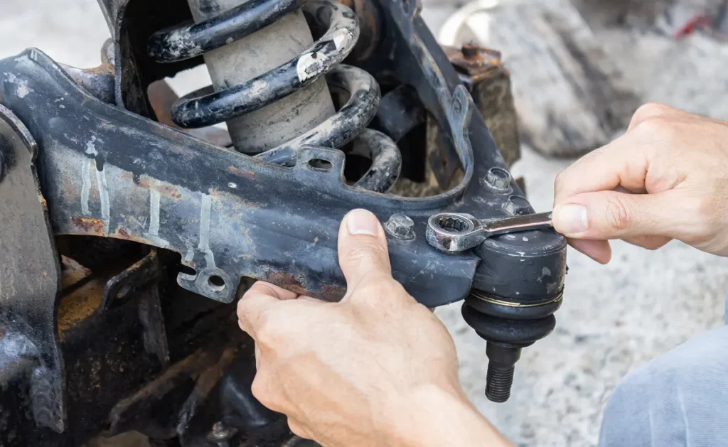 What are the symptoms of a failing ball joint?